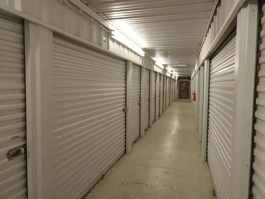 Interior corridor of storage units with polished floors at Town and Country Self Storage_.webp